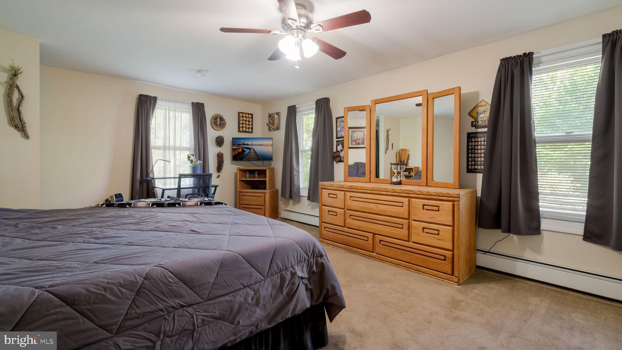 500 Prospect Road Warminster, PA 18974 - Photo 13 of 28 a bedroom with a bed and a large window with the dresser