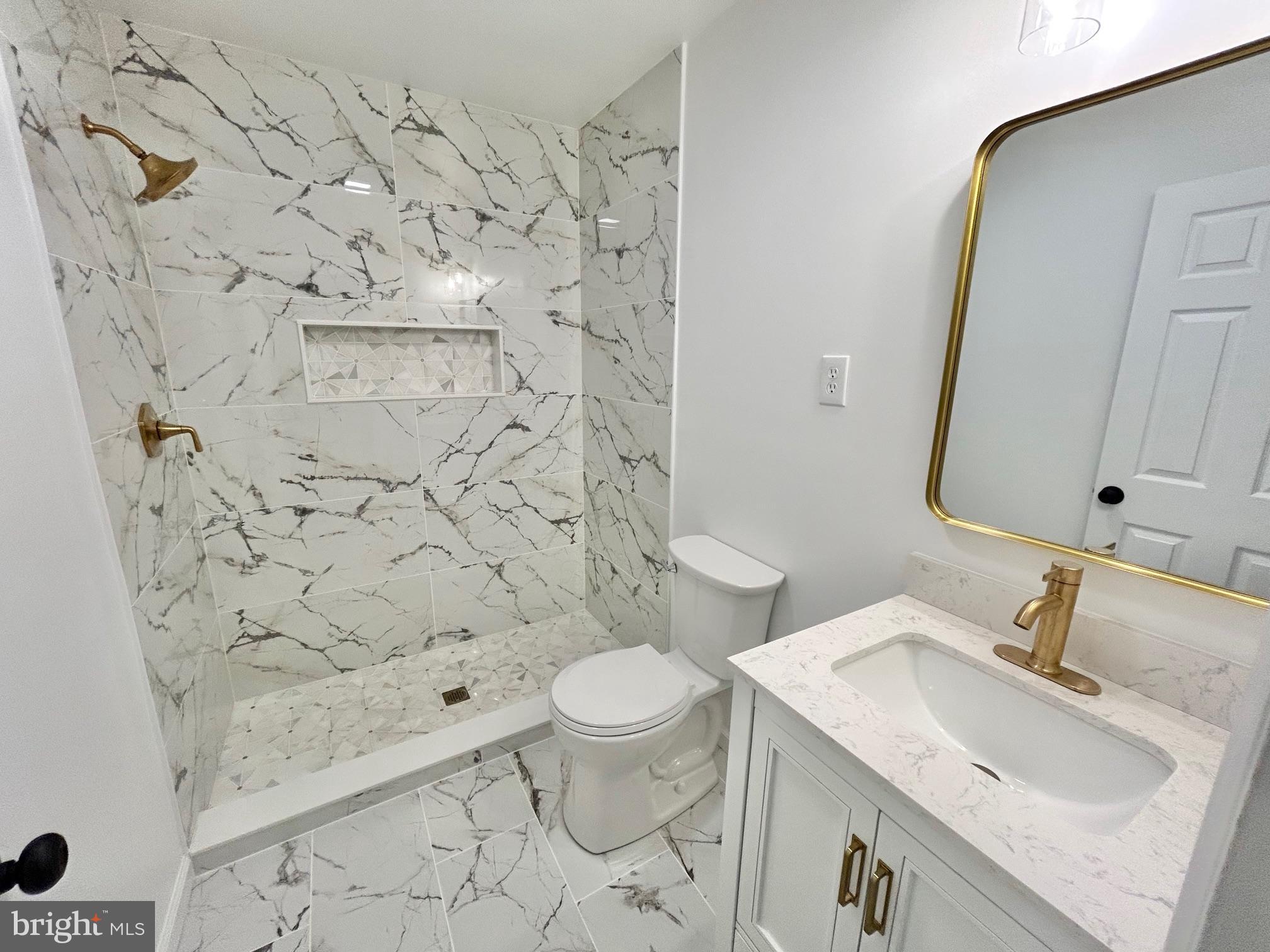 1224 Grinnell Road Wilmington, DE 19803 - Photo 20 of 48 a bathroom with a sink toilet and shower
