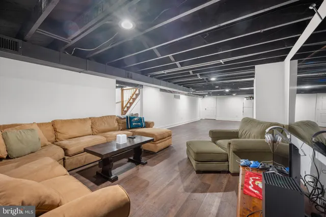 a media room with lots of chairs and a projector