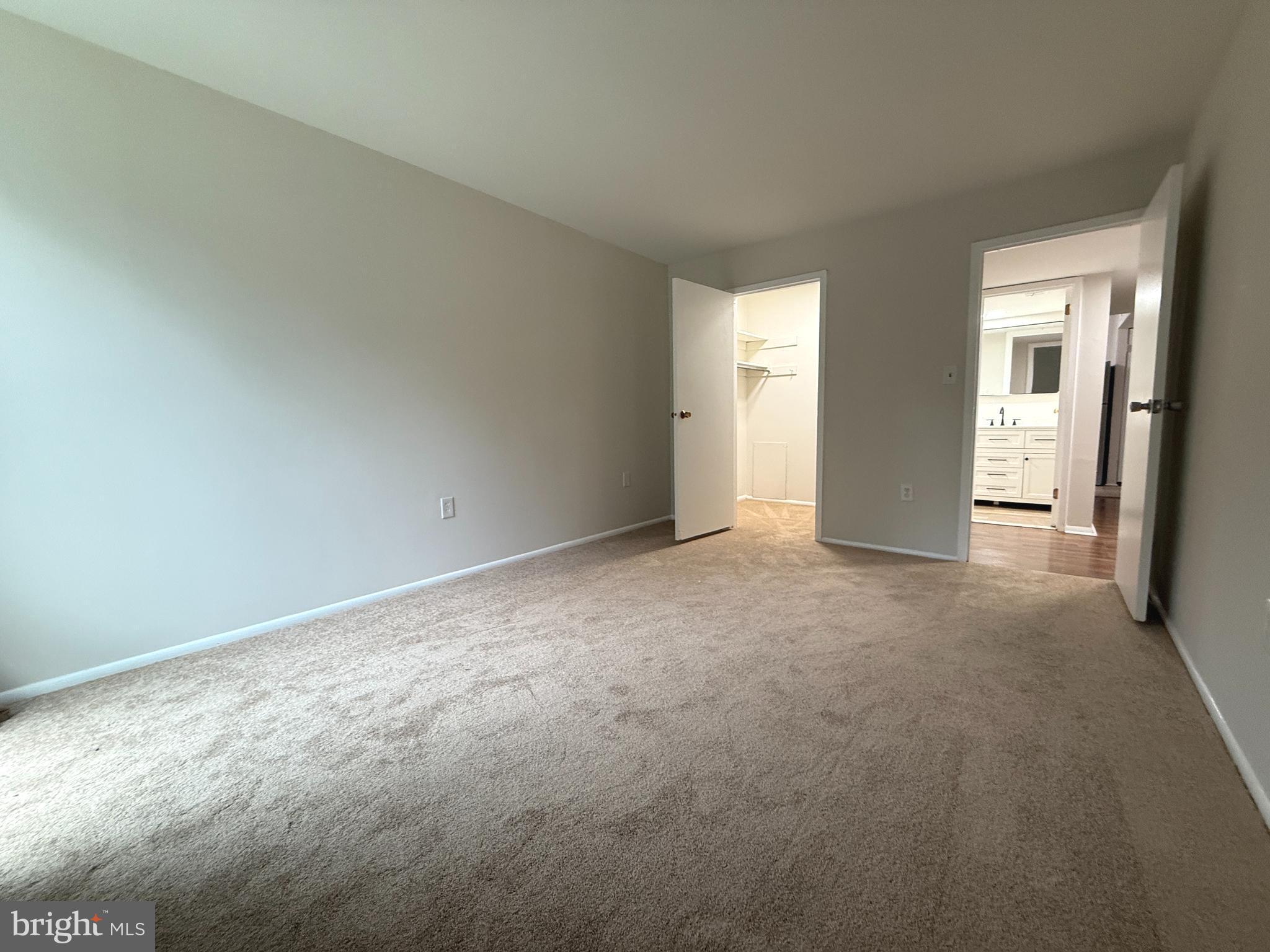 8689 Greenbelt Road, Unit 101 Greenbelt, MD 20770 - Photo 20 of 27 wooden floor and window in an empty room