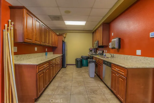 an aerial view of a house with a yard and potted plants