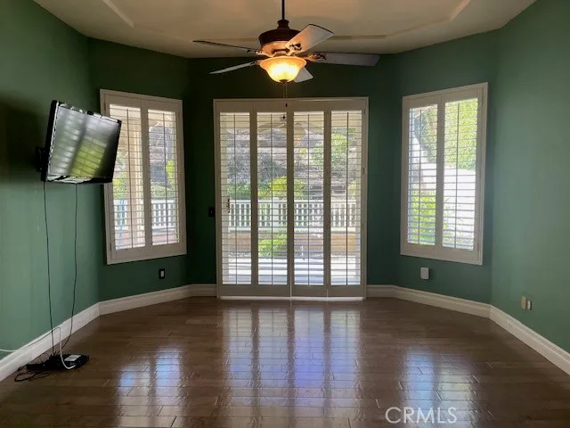 a bathroom with a granite countertop sink and a bathtub