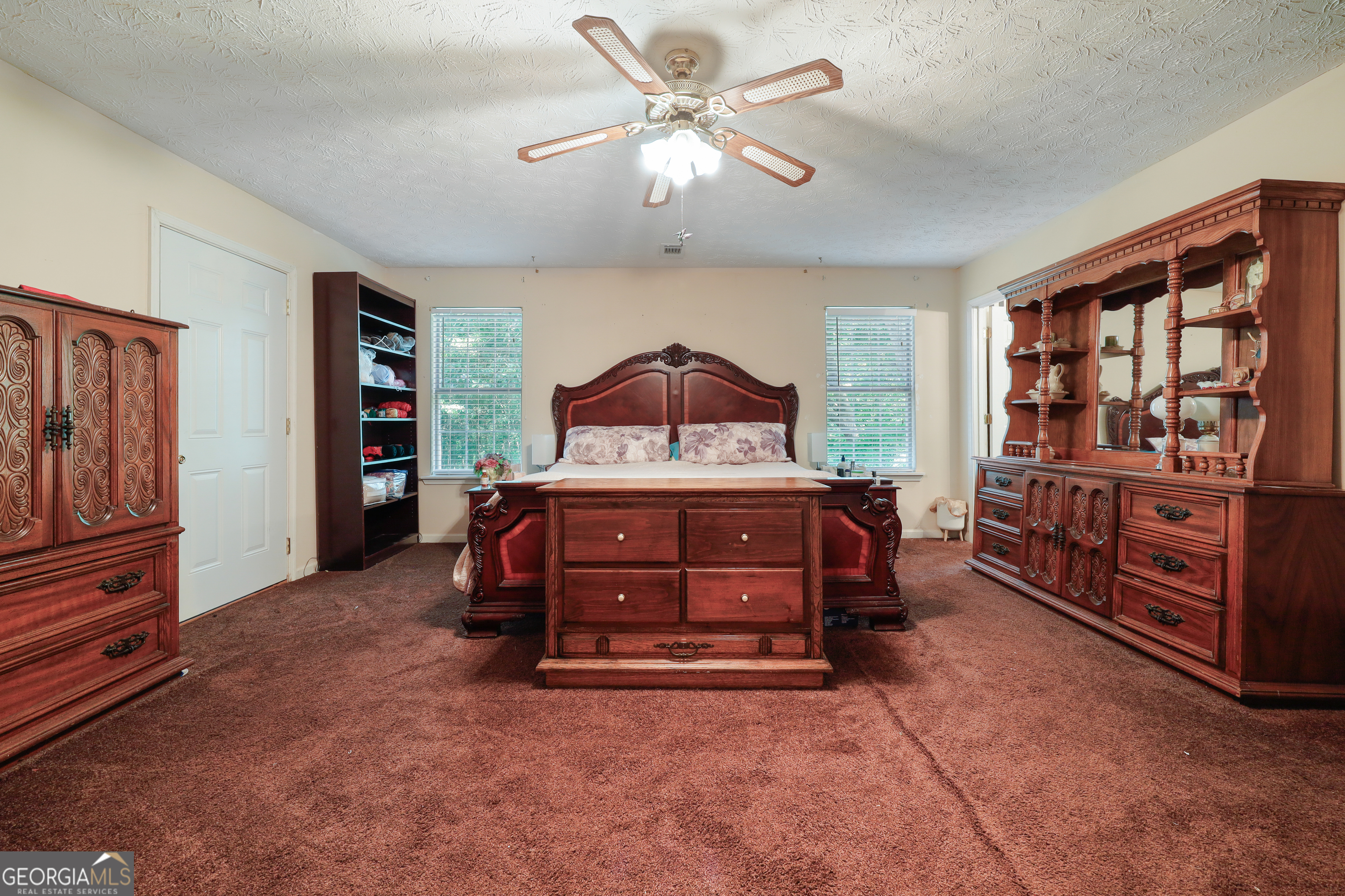 2433 Bear Creek Road Statham, GA 30666 - Photo 21 of 58 a bedroom with a bed and a closet