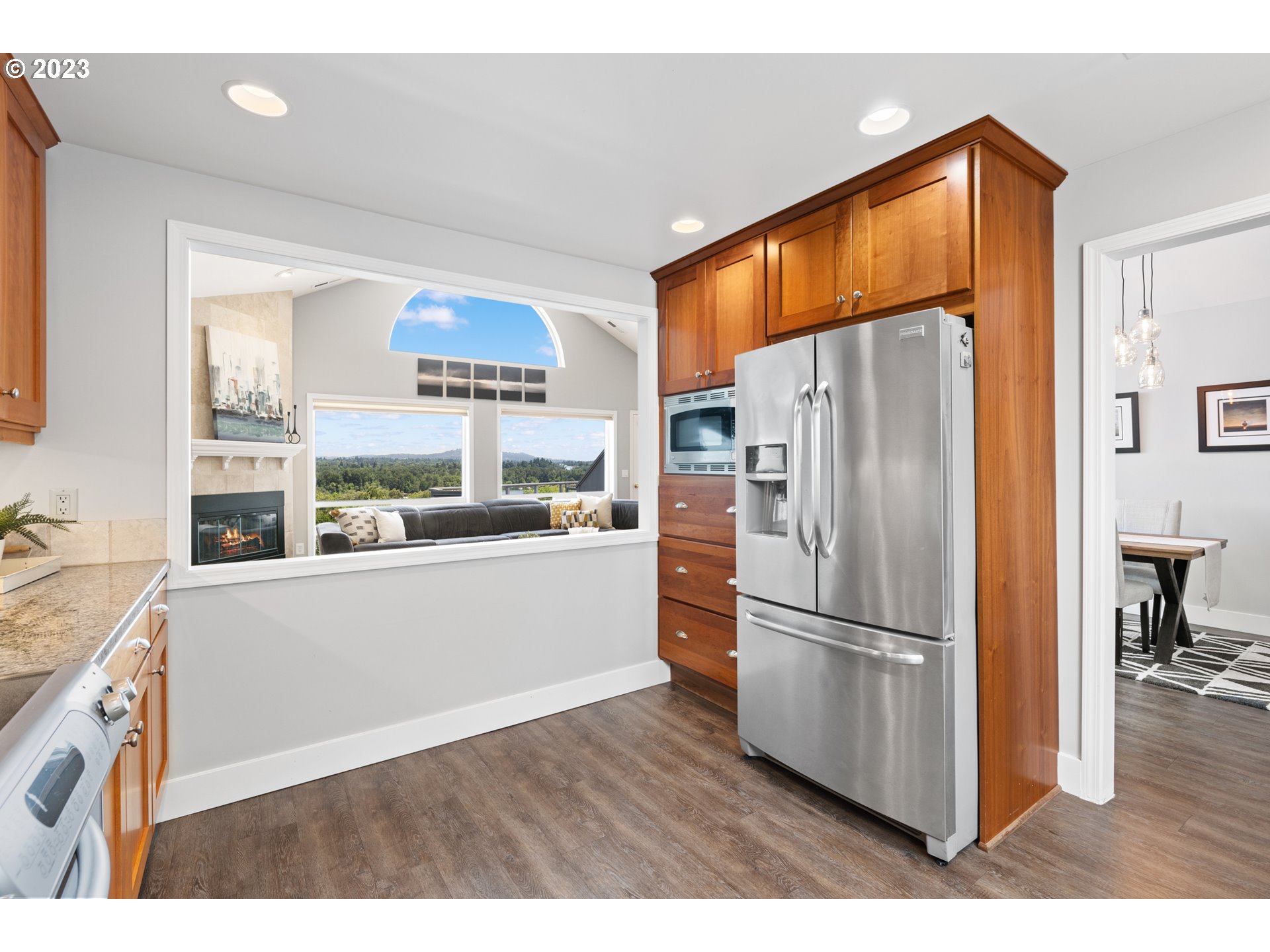 5411 Southwest View Point Terrace Portland, OR 97239 - Photo 12 of 44 a kitchen with stainless steel appliances a refrigerator and a stove top oven