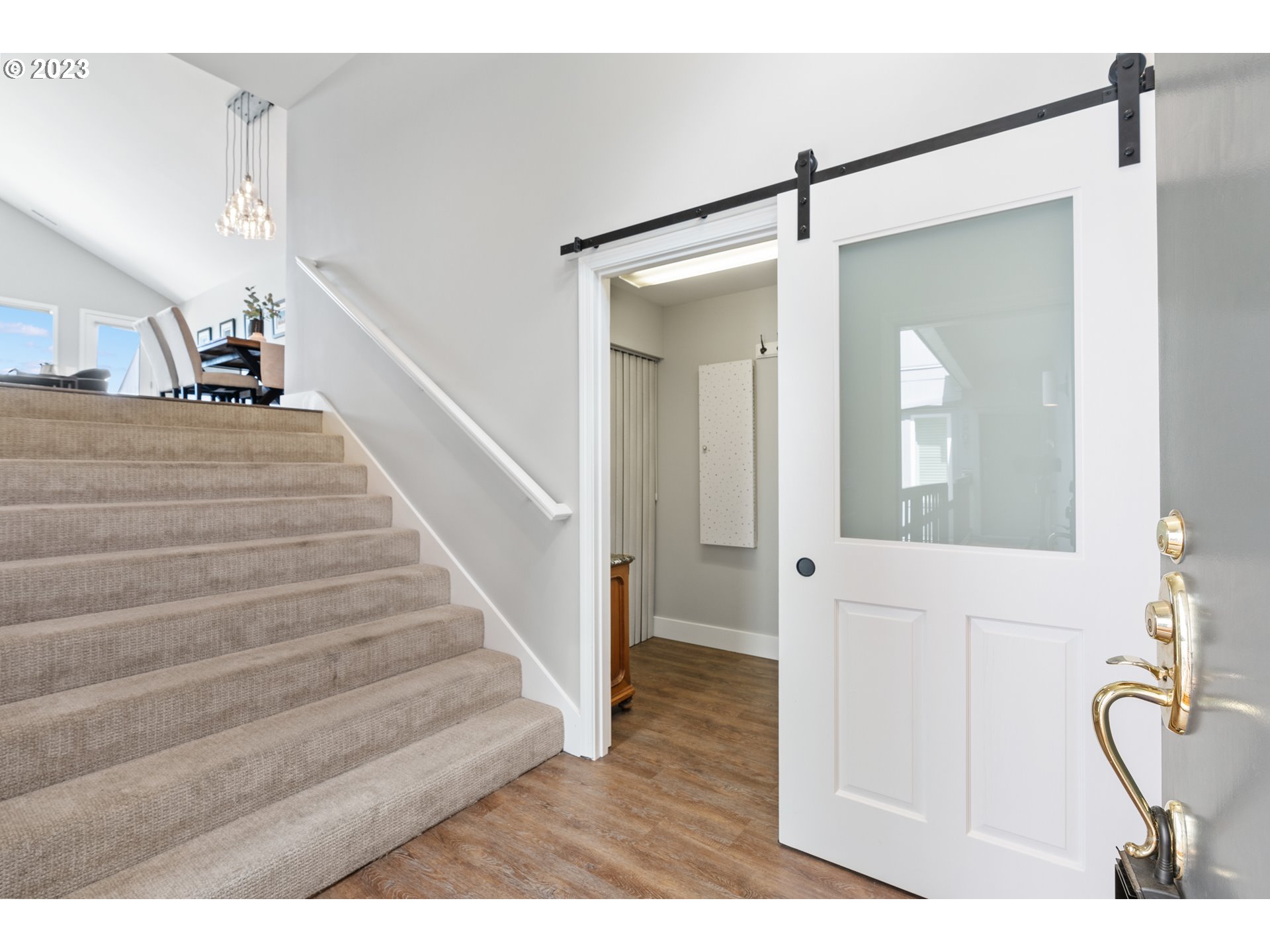 5411 Southwest View Point Terrace Portland, OR 97239 - Photo 2 of 44 a view of a hallway with wooden floor and staircase