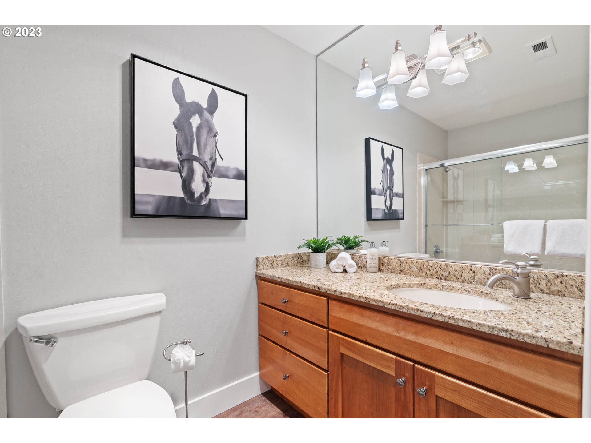 5411 Southwest View Point Terrace Portland, OR 97239 - Photo 26 of 44 a bathroom with a granite countertop sink mirror and toilet