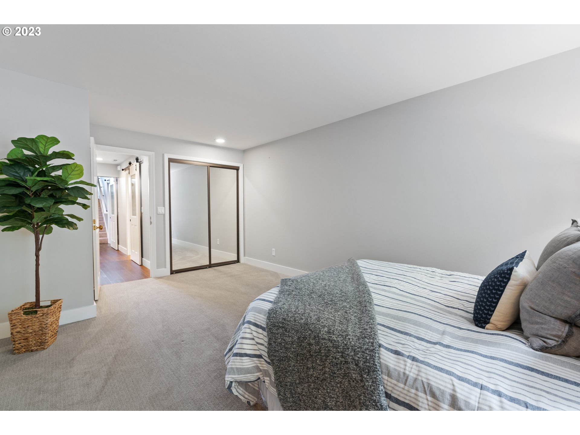 5411 Southwest View Point Terrace Portland, OR 97239 - Photo 28 of 44 a bedroom with a bed and a potted plant