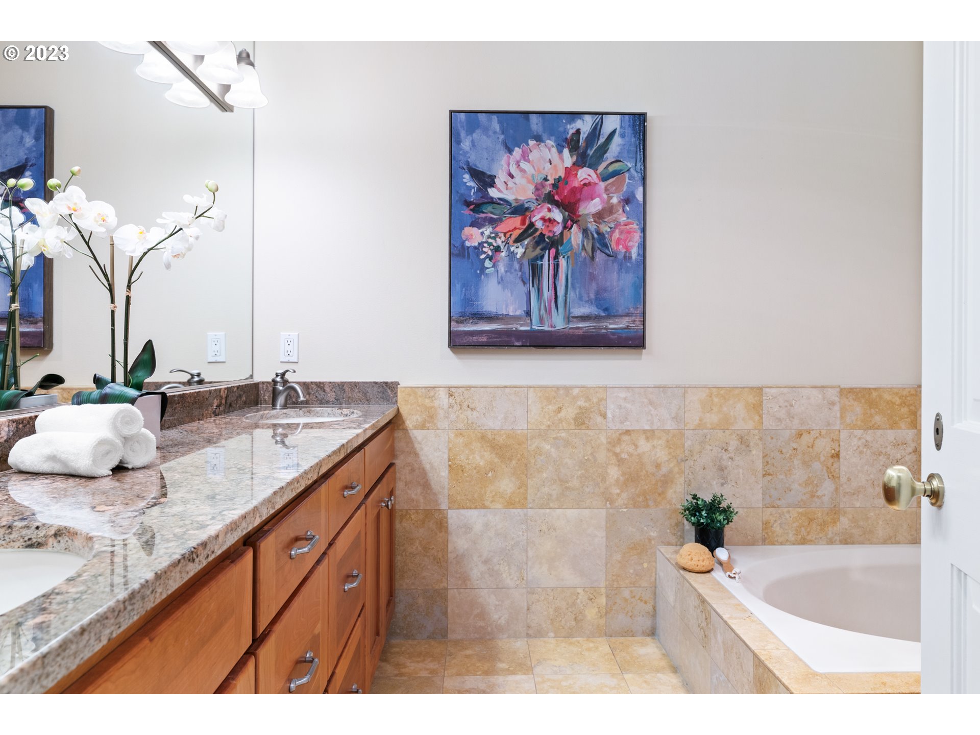 5411 Southwest View Point Terrace Portland, OR 97239 - Photo 32 of 44 a bathroom with a granite countertop sink mirror and bathtub