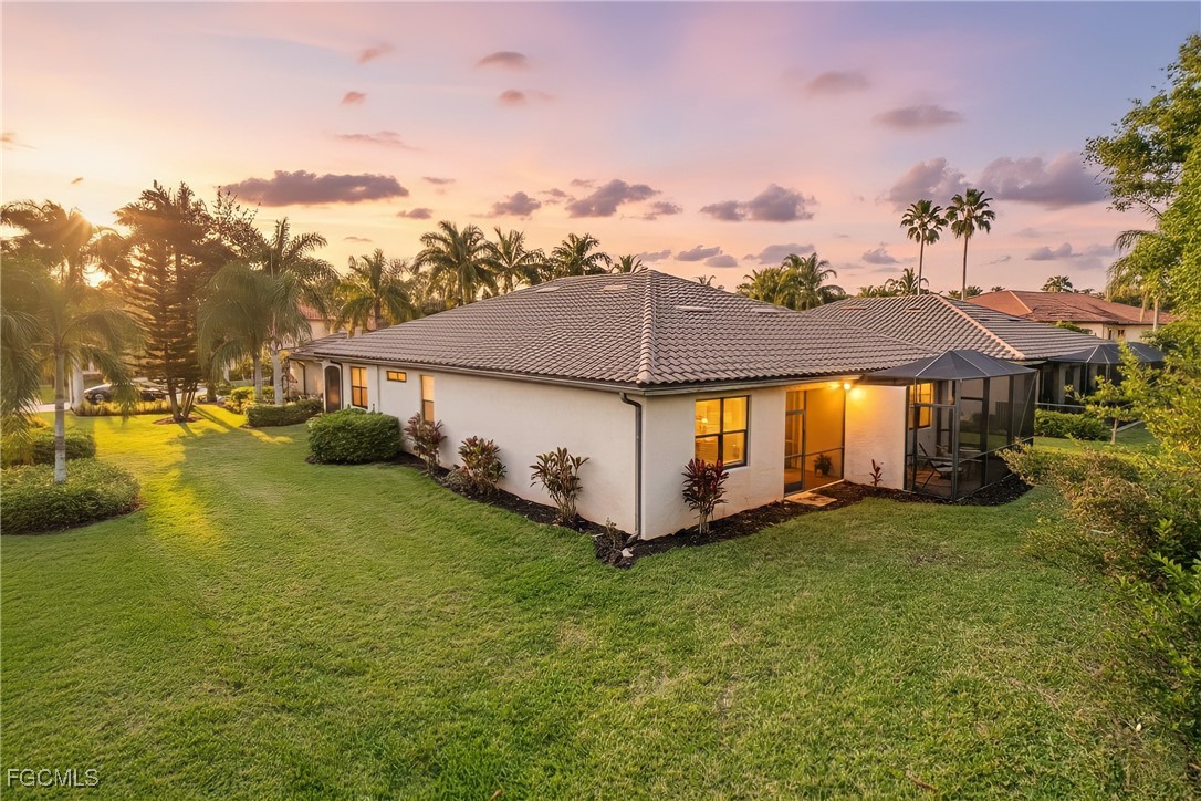 9101 Water Tupelo Road Fort Myers, FL 33912 - Photo 2 of 43 a view of a house with a big yard