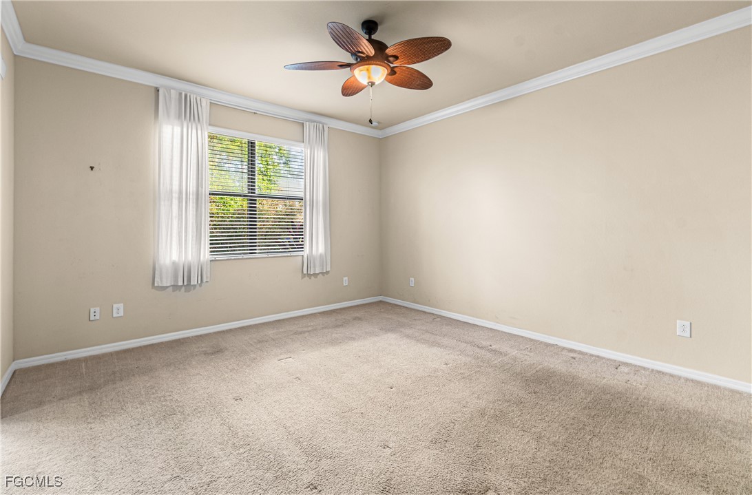 9101 Water Tupelo Road Fort Myers, FL 33912 - Photo 22 of 43 a view of an empty room with a window