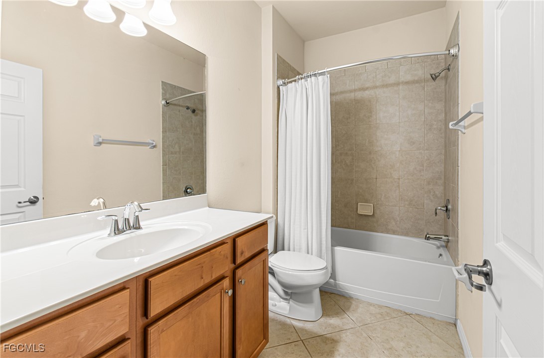 9101 Water Tupelo Road Fort Myers, FL 33912 - Photo 23 of 43 a bathroom with a sink toilet and shower