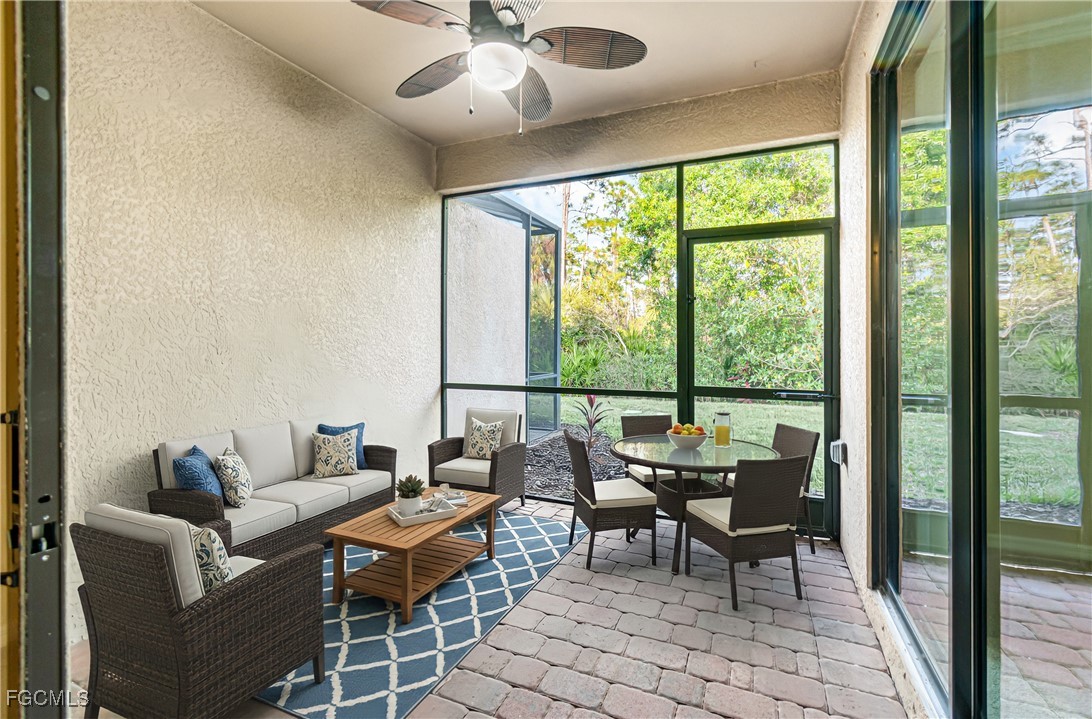 9101 Water Tupelo Road Fort Myers, FL 33912 - Photo 24 of 43 a living room with furniture and a large window