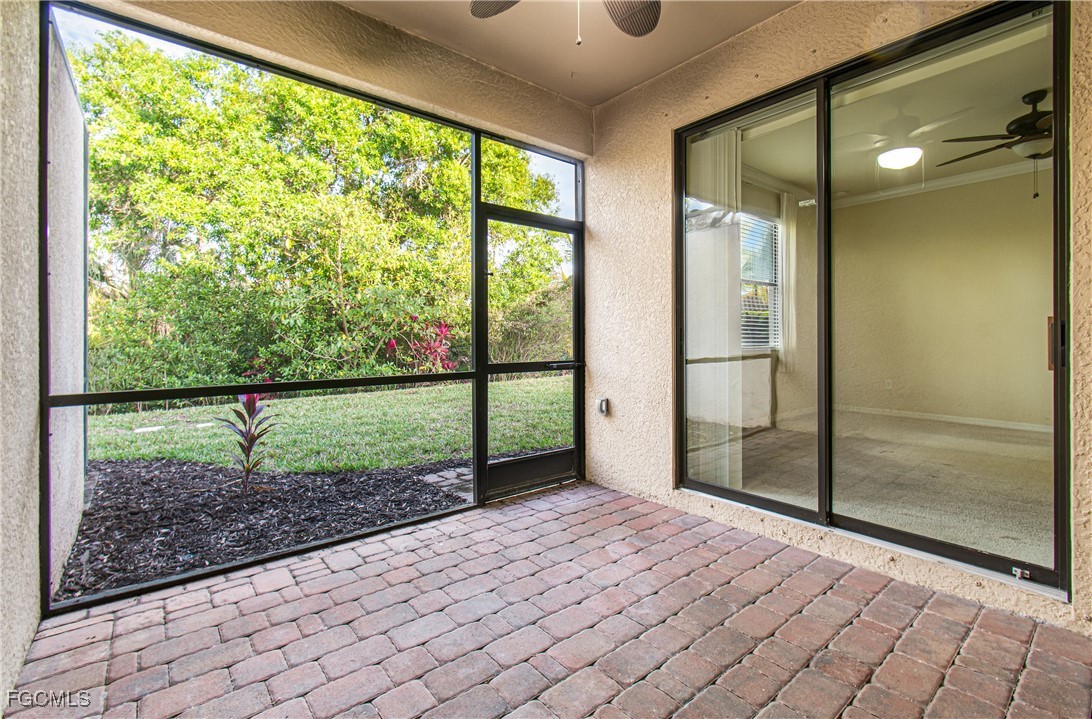 9101 Water Tupelo Road Fort Myers, FL 33912 - Photo 25 of 43 a view of empty room with wooden floor and fan