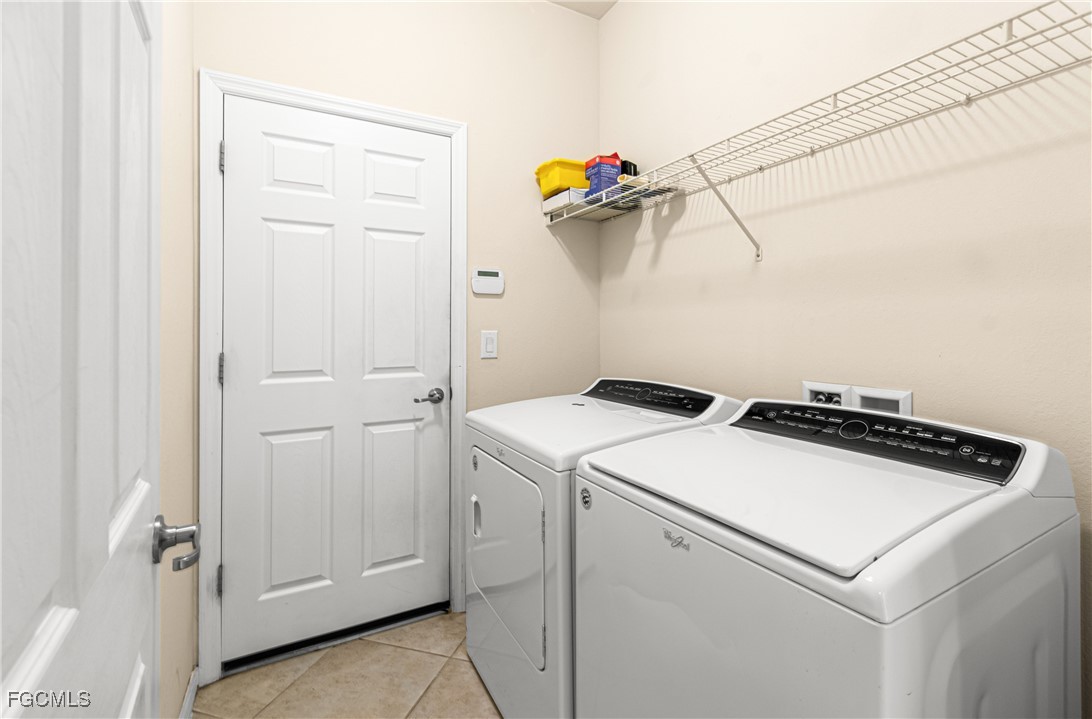 9101 Water Tupelo Road Fort Myers, FL 33912 - Photo 27 of 43 a utility room with dryer and washer
