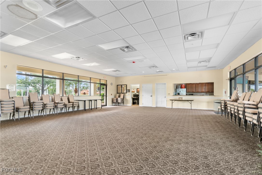 9101 Water Tupelo Road Fort Myers, FL 33912 - Photo 40 of 43 a living room with furniture and a large window