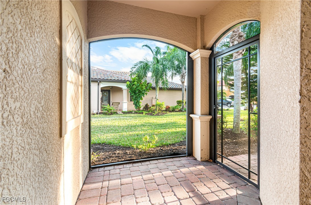 9101 Water Tupelo Road Fort Myers, FL 33912 - Photo 4 of 43 a front view of a house with garden