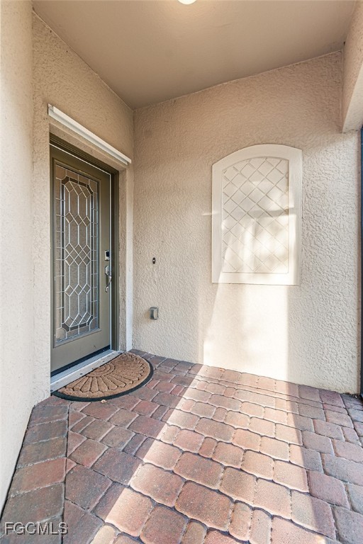 9101 Water Tupelo Road Fort Myers, FL 33912 - Photo 5 of 43 a view of front door of a house