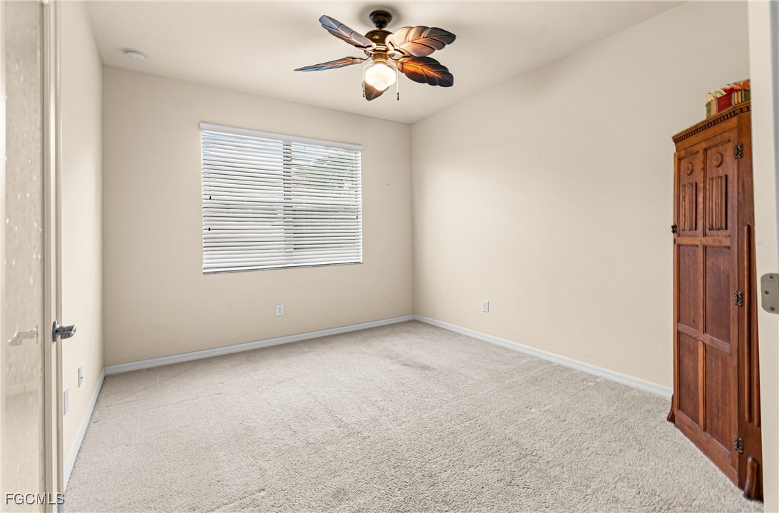 9101 Water Tupelo Road Fort Myers, FL 33912 - Photo 7 of 43 a view of an empty room with a window