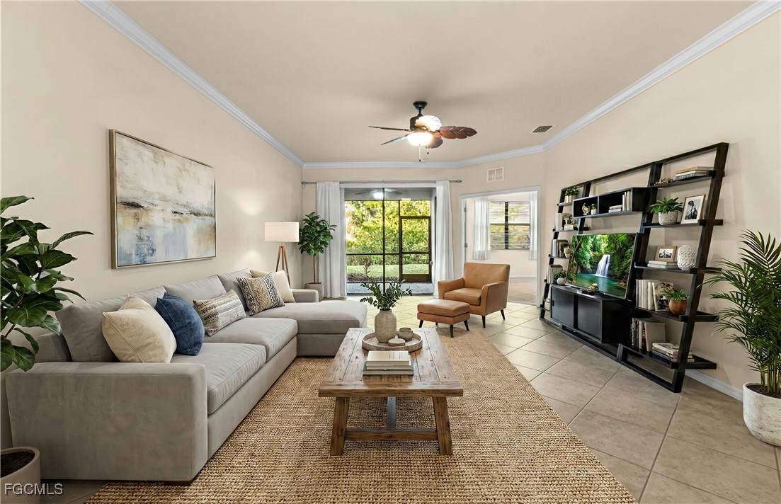 9101 Water Tupelo Road Fort Myers, FL 33912 - Photo 8 of 43 a living room with furniture and a flat screen tv
