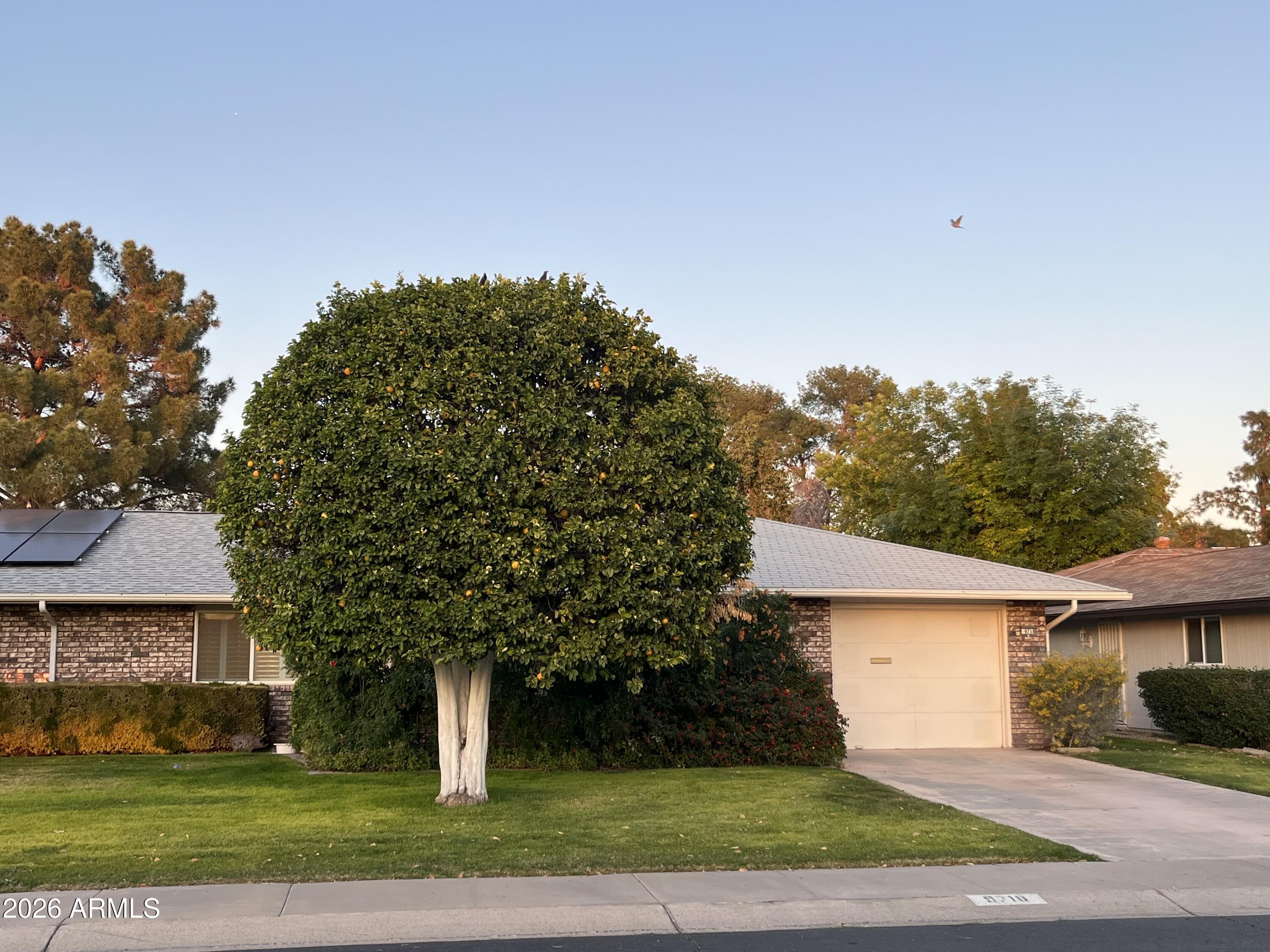 front view of a house with a yard