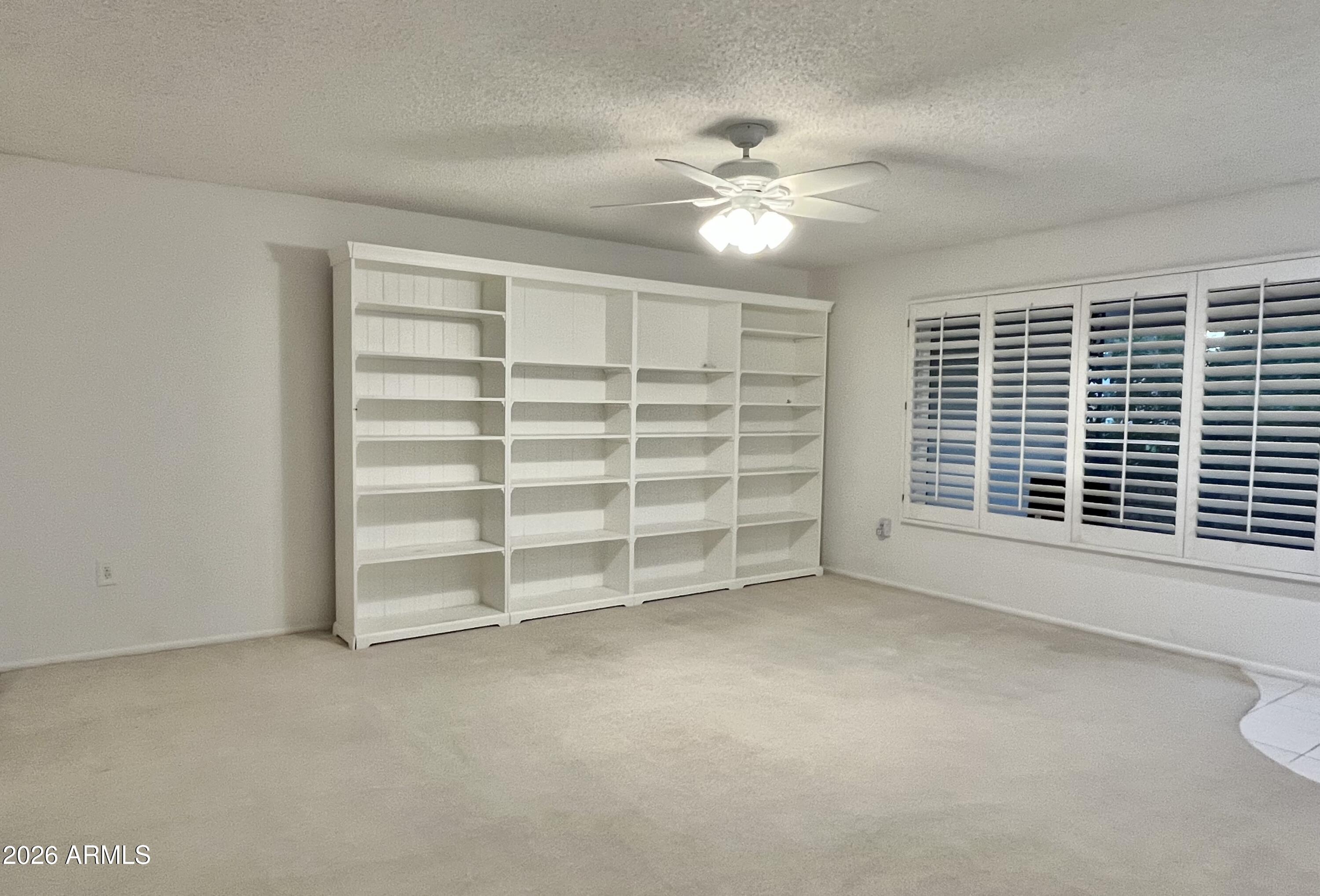 9718 West Oak Ridge Drive Sun City, AZ 85351 - Photo 11 of 41 a view of an empty room with a window