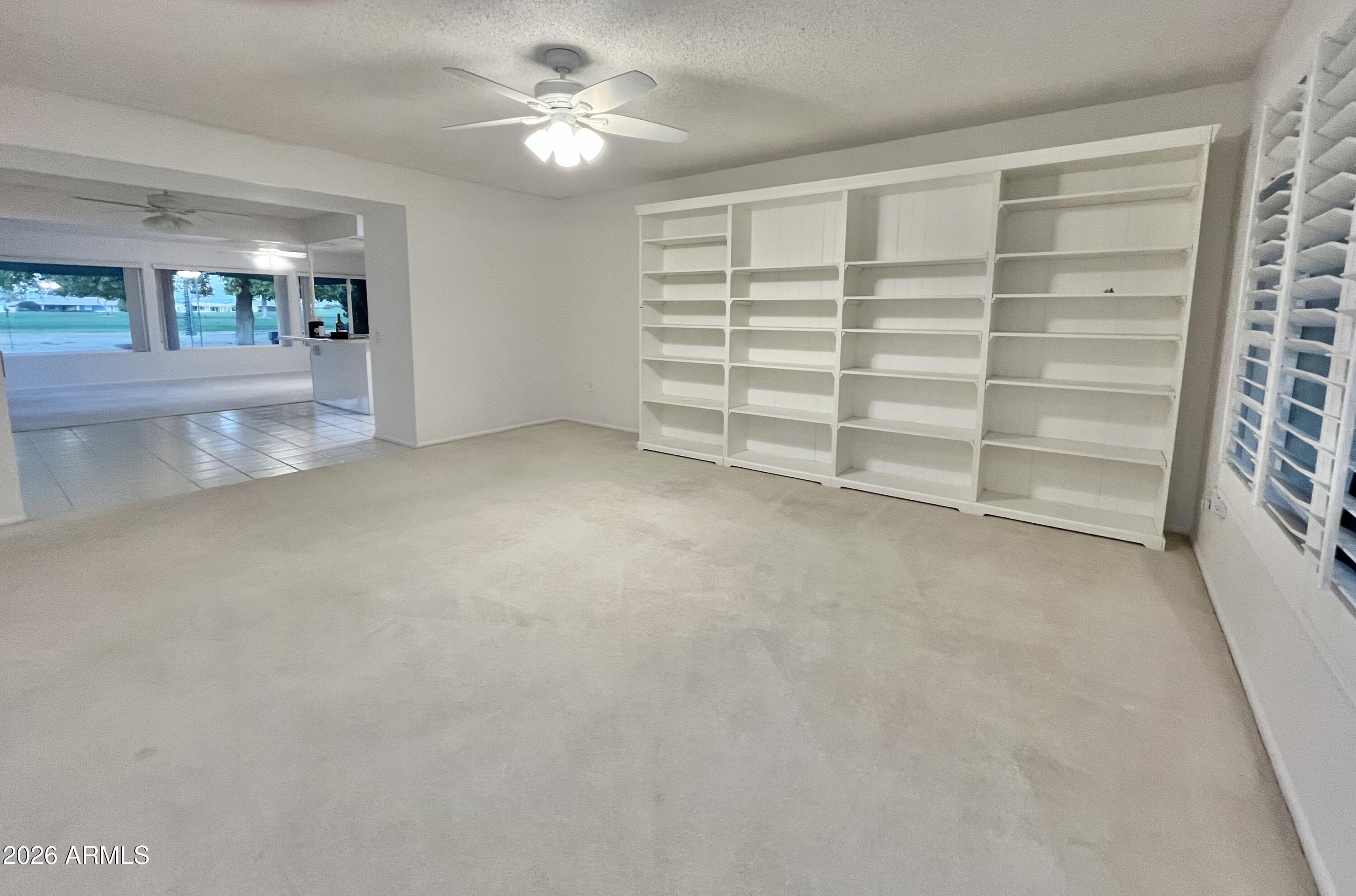 9718 West Oak Ridge Drive Sun City, AZ 85351 - Photo 12 of 41 a view of an empty room with a window