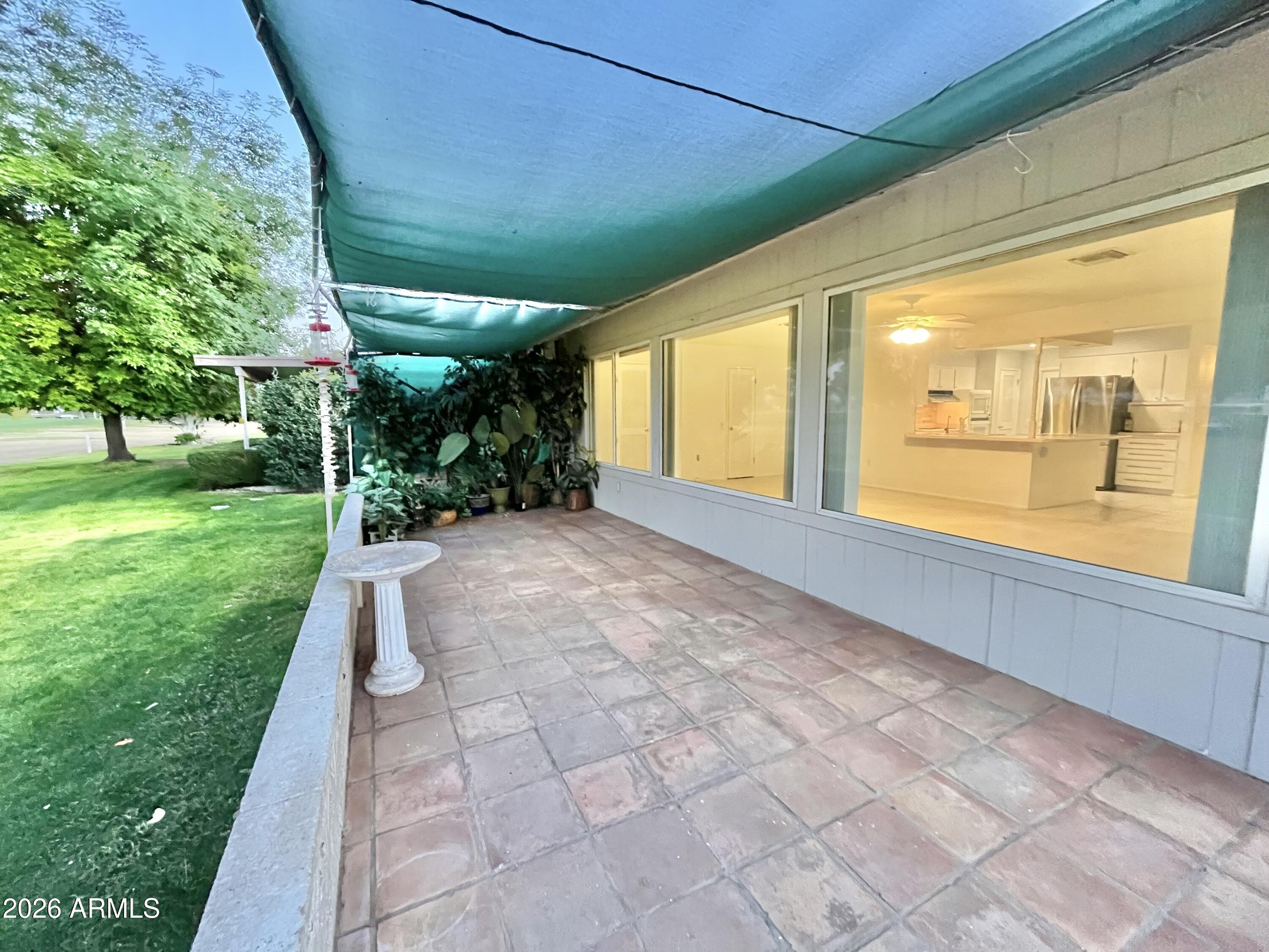 9718 West Oak Ridge Drive Sun City, AZ 85351 - Photo 22 of 41 a view of backyard with green space