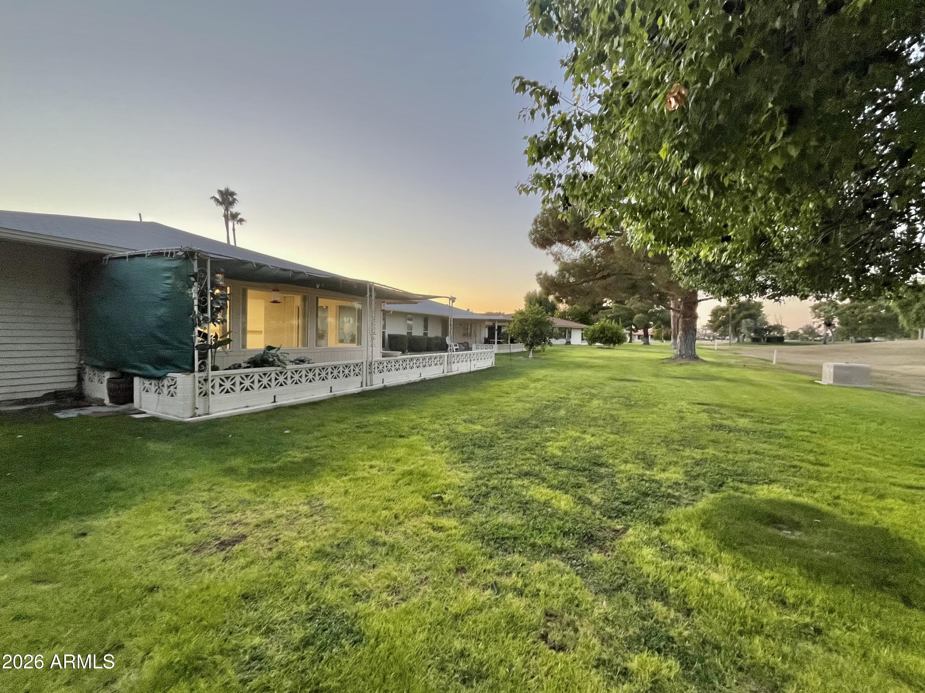 9718 West Oak Ridge Drive Sun City, AZ 85351 - Photo 24 of 41 a front view of house with yard