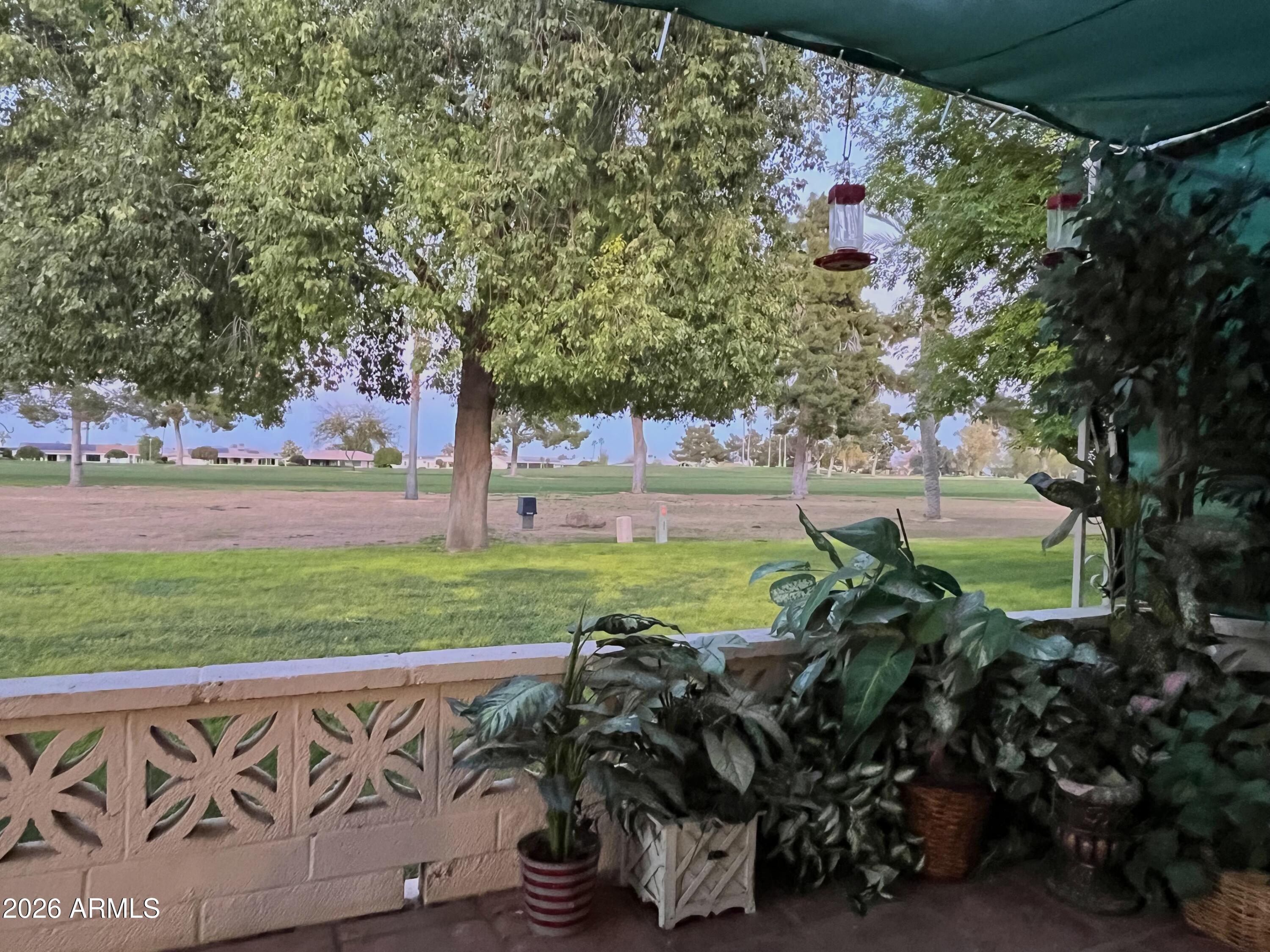 9718 West Oak Ridge Drive Sun City, AZ 85351 - Photo 26 of 41 a view of a garden with an outdoor space