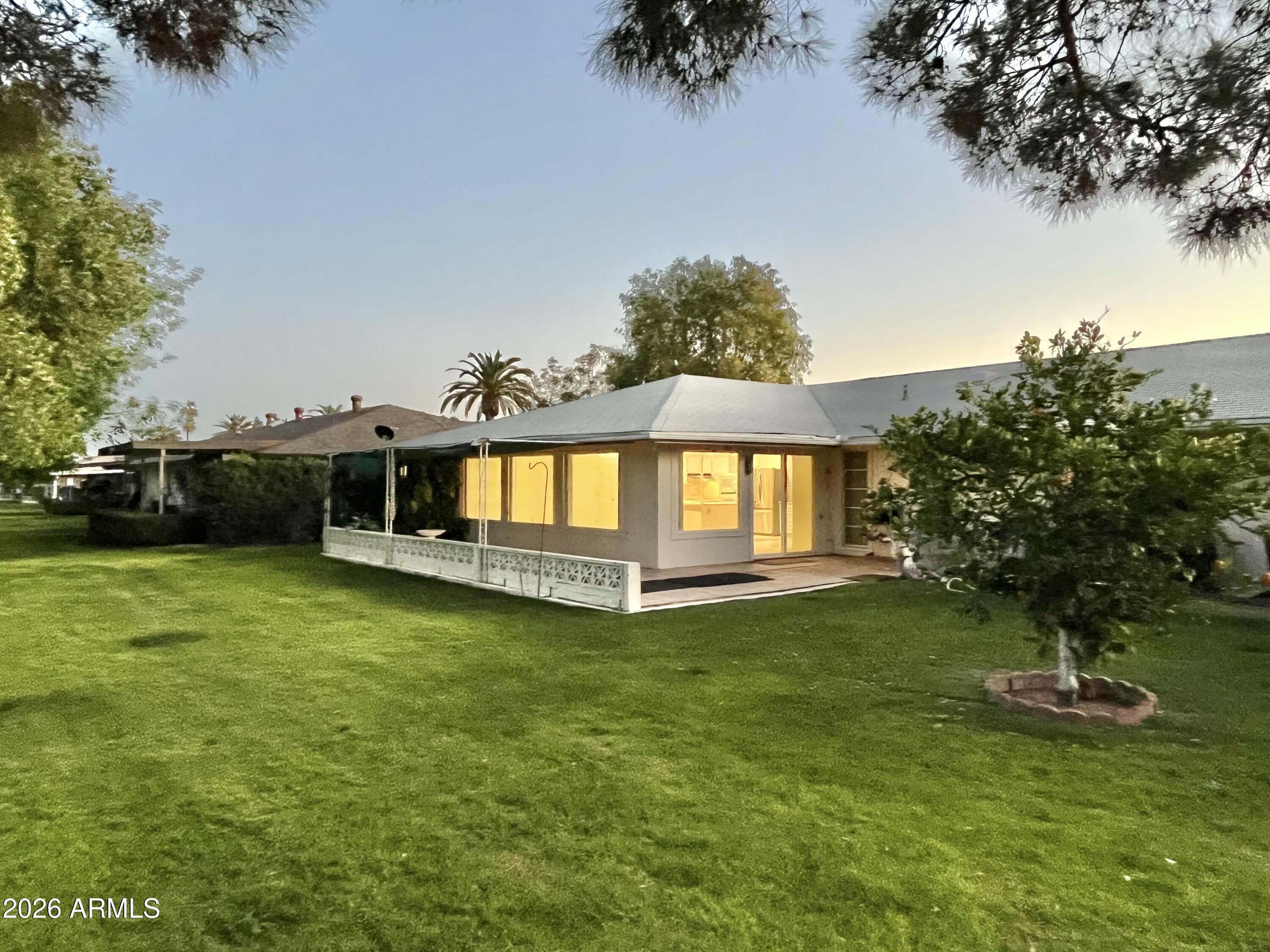 9718 West Oak Ridge Drive Sun City, AZ 85351 - Photo 38 of 41 a view of a house with a yard