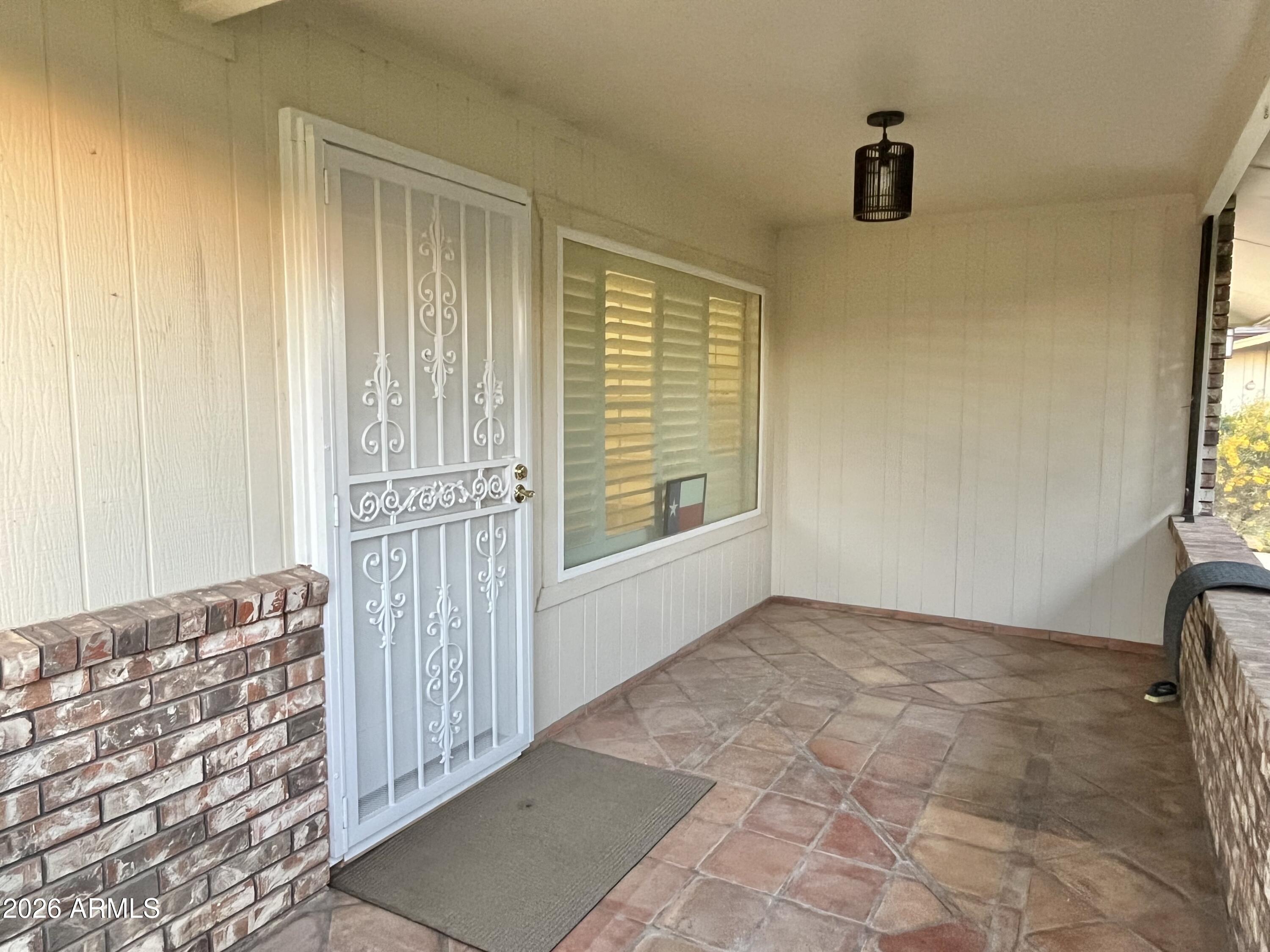 9718 West Oak Ridge Drive Sun City, AZ 85351 - Photo 7 of 41 a view of an empty room with a window