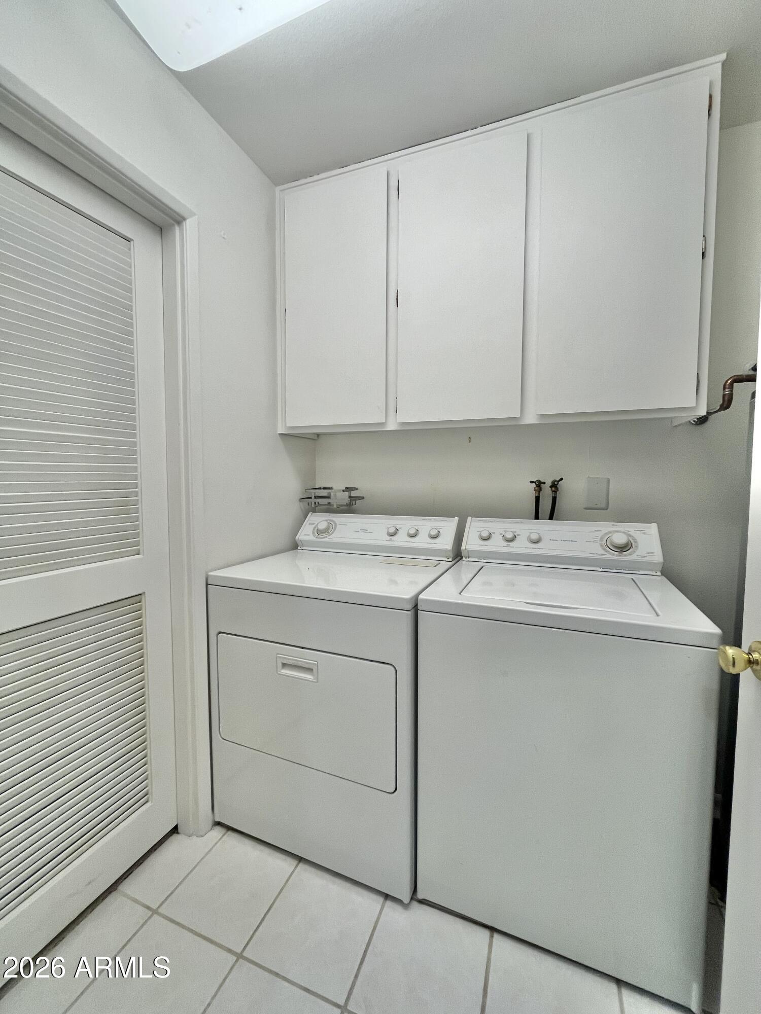 9718 West Oak Ridge Drive Sun City, AZ 85351 - Photo 10 of 41 a utility room with dryer and washer