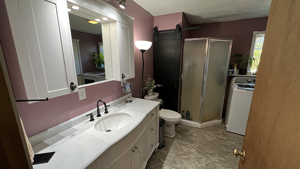 18510 Sand Road Fulton, IL 61252 - Photo 11 of 54 a bathroom with a sink toilet and shower