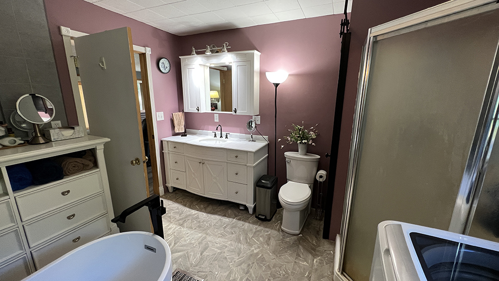 18510 Sand Road Fulton, IL 61252 - Photo 13 of 54 a bathroom with a sink vanity granite tub and shower