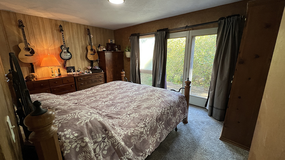 18510 Sand Road Fulton, IL 61252 - Photo 14 of 54 a bed sitting in a bedroom next to a window