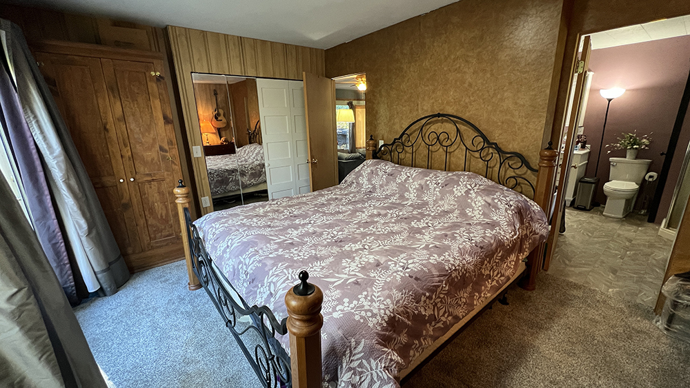 18510 Sand Road Fulton, IL 61252 - Photo 15 of 54 a bedroom with a bed window and a dresser