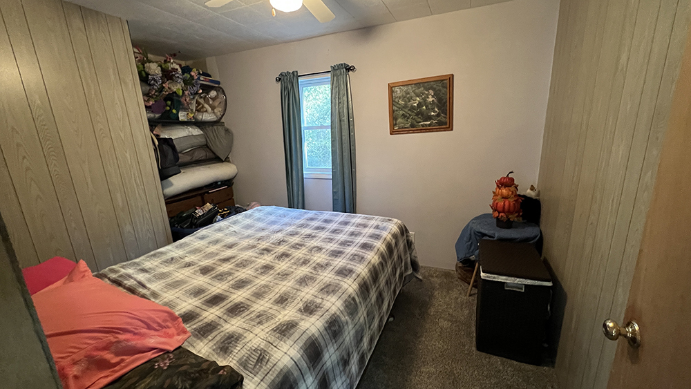 18510 Sand Road Fulton, IL 61252 - Photo 16 of 54 a bedroom with a bed and wooden floor