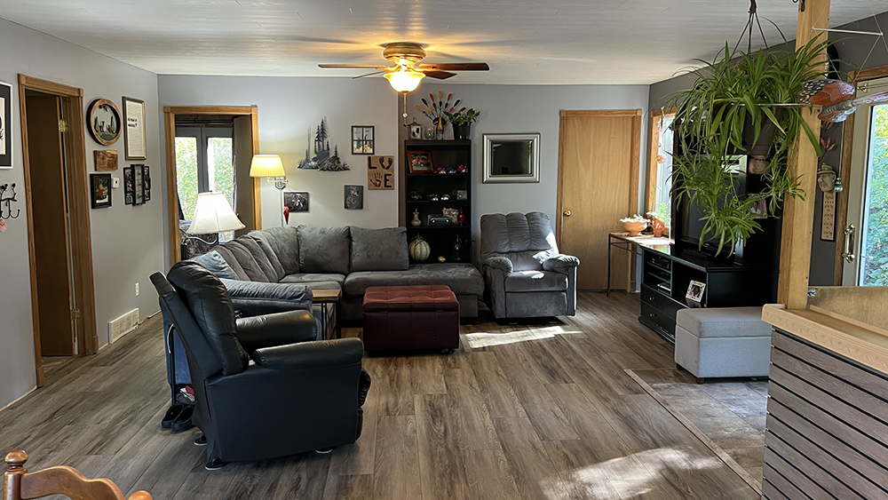 18510 Sand Road Fulton, IL 61252 - Photo 7 of 54 a living room with furniture and a fireplace