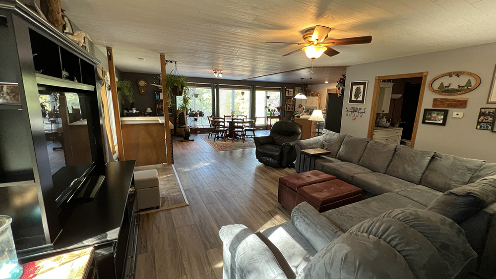18510 Sand Road Fulton, IL 61252 - Photo 8 of 54 a living room with furniture a ceiling fan and a window