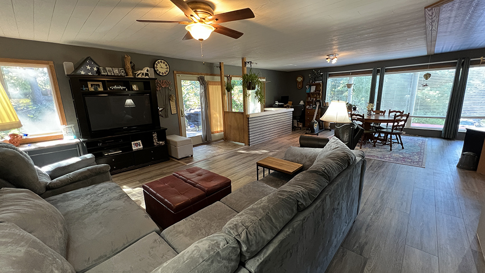 18510 Sand Road Fulton, IL 61252 - Photo 9 of 54 a living room with furniture and a flat screen tv