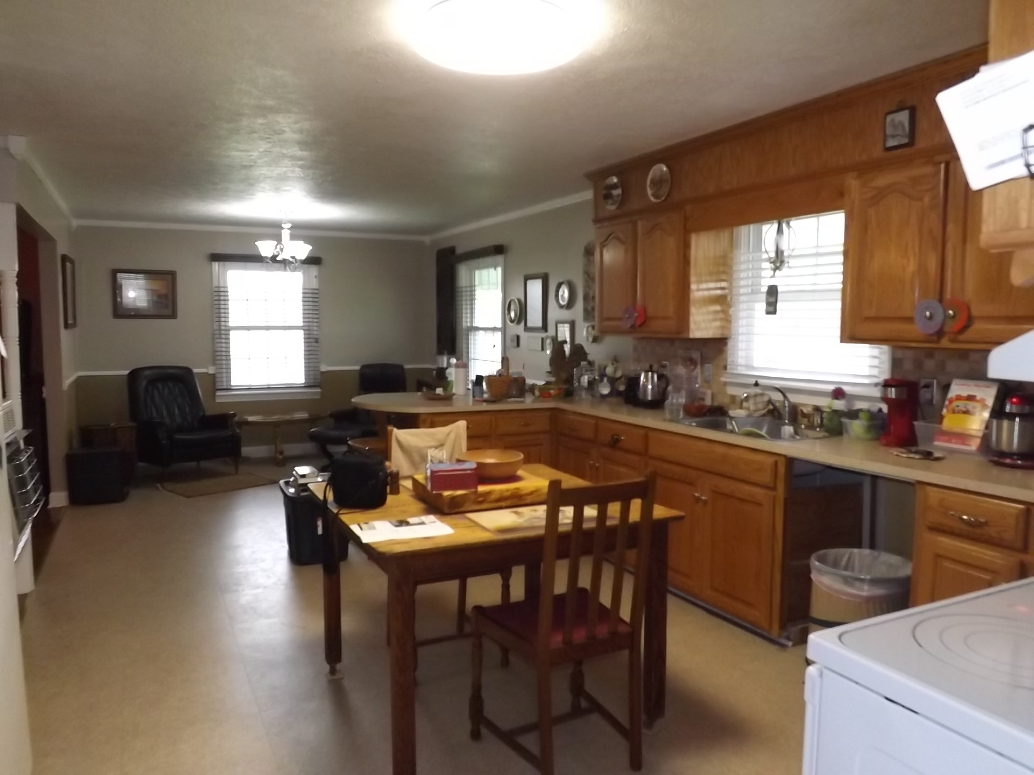 844 Pocahontas Road Morrison, TN 37357 - Photo 8 of 24 a kitchen with a stove a sink a dining table and chairs