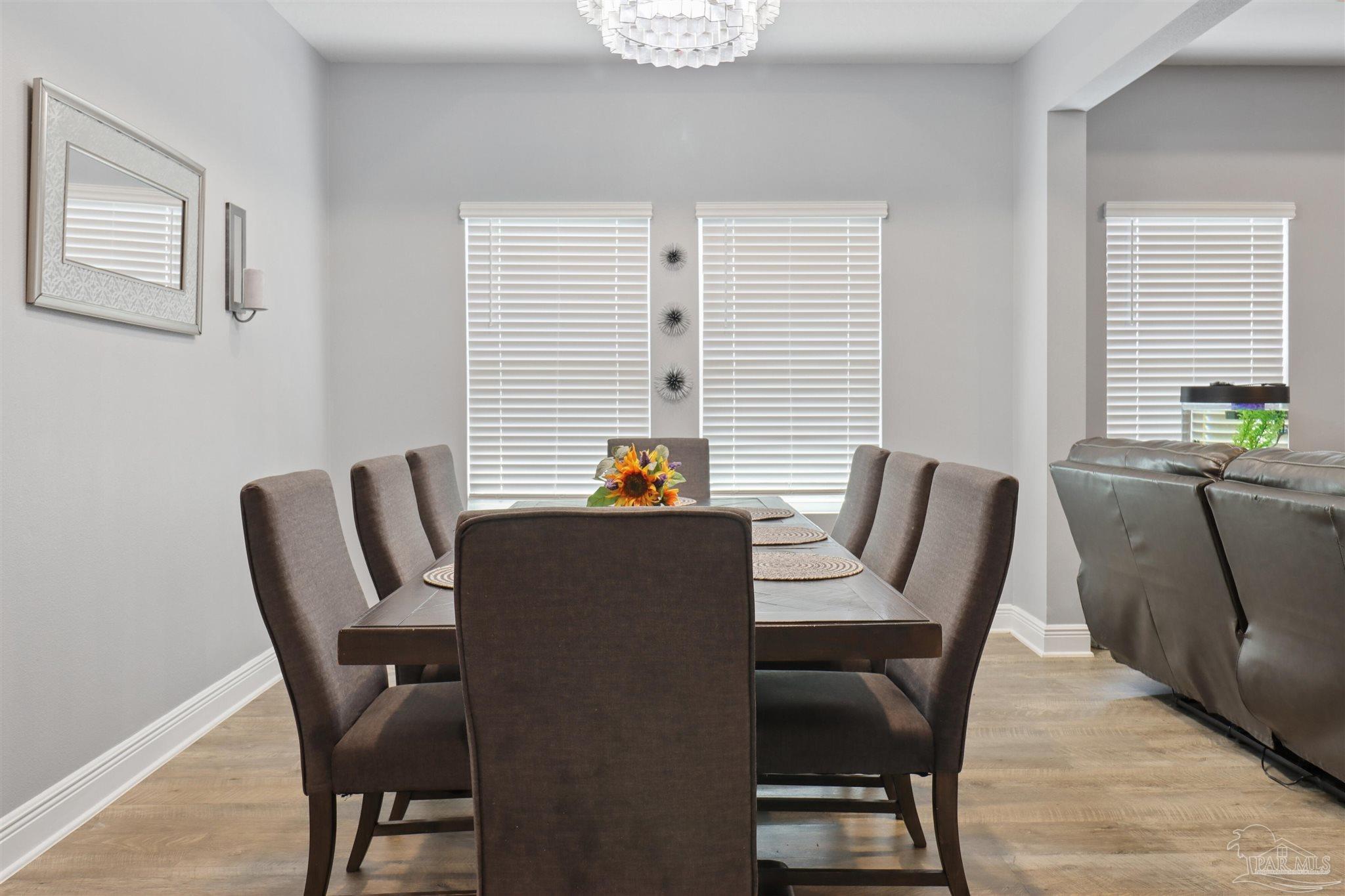 335 Cayden Way Cantonment, FL 32533 - Photo 15 of 30 a dining room with furniture and windows