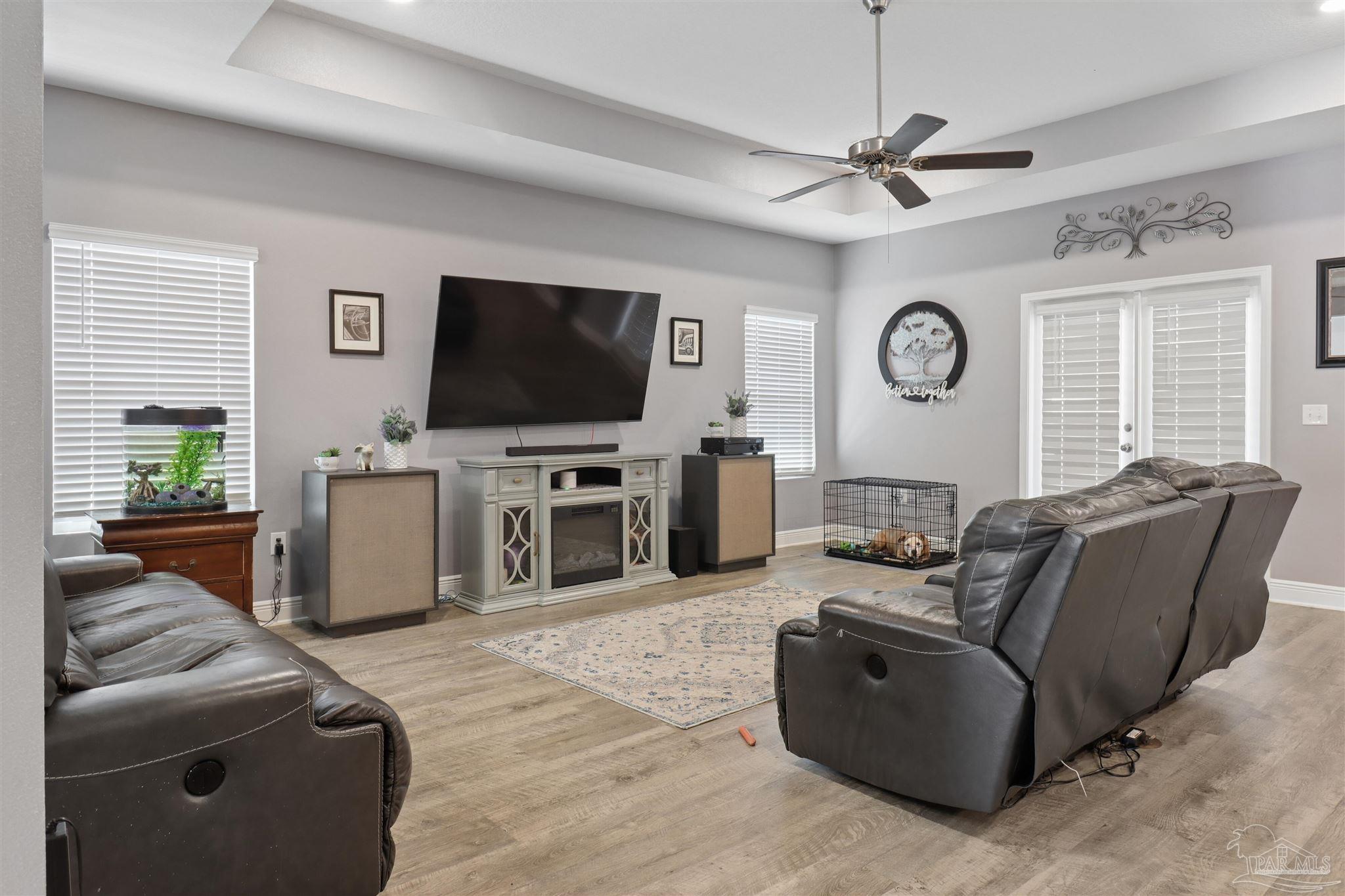 335 Cayden Way Cantonment, FL 32533 - Photo 16 of 30 a living room with furniture and a flat screen tv