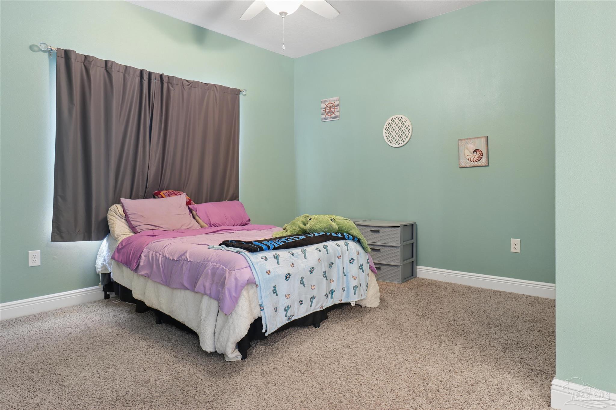 335 Cayden Way Cantonment, FL 32533 - Photo 2 of 30 a bedroom with a bed and a window