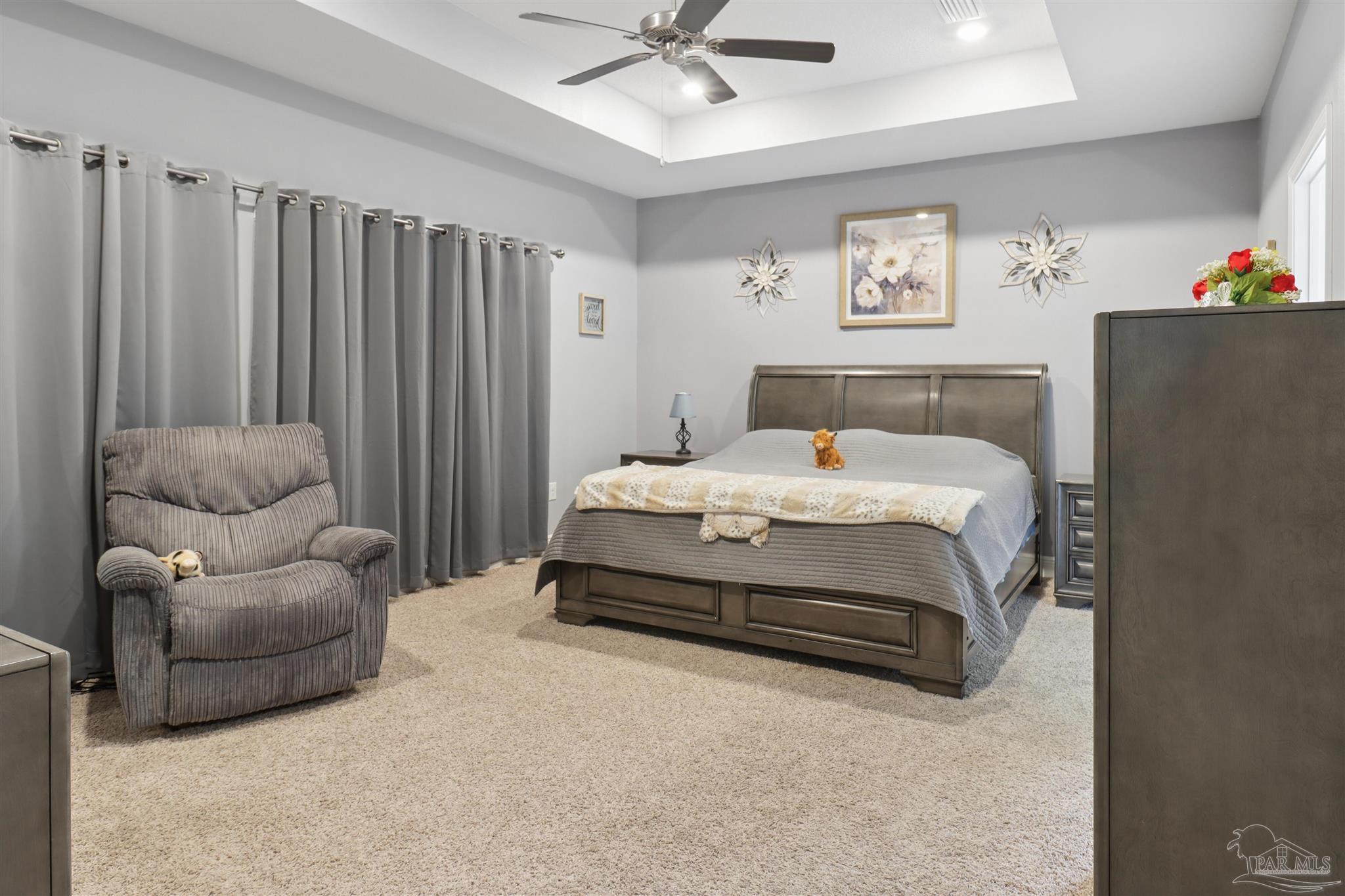 335 Cayden Way Cantonment, FL 32533 - Photo 21 of 30 a bedroom with bed and a couch