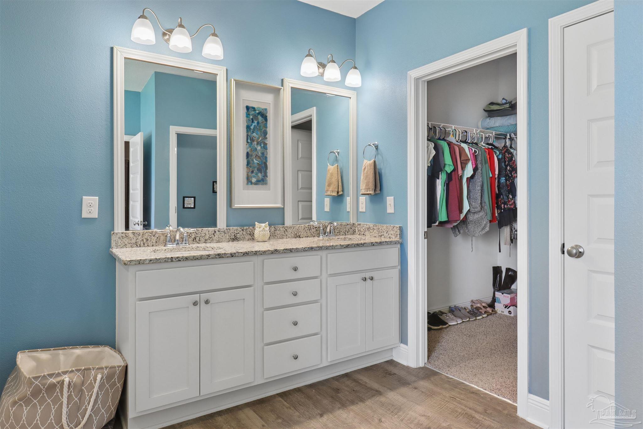 335 Cayden Way Cantonment, FL 32533 - Photo 23 of 30 a bathroom with a sink and a mirror