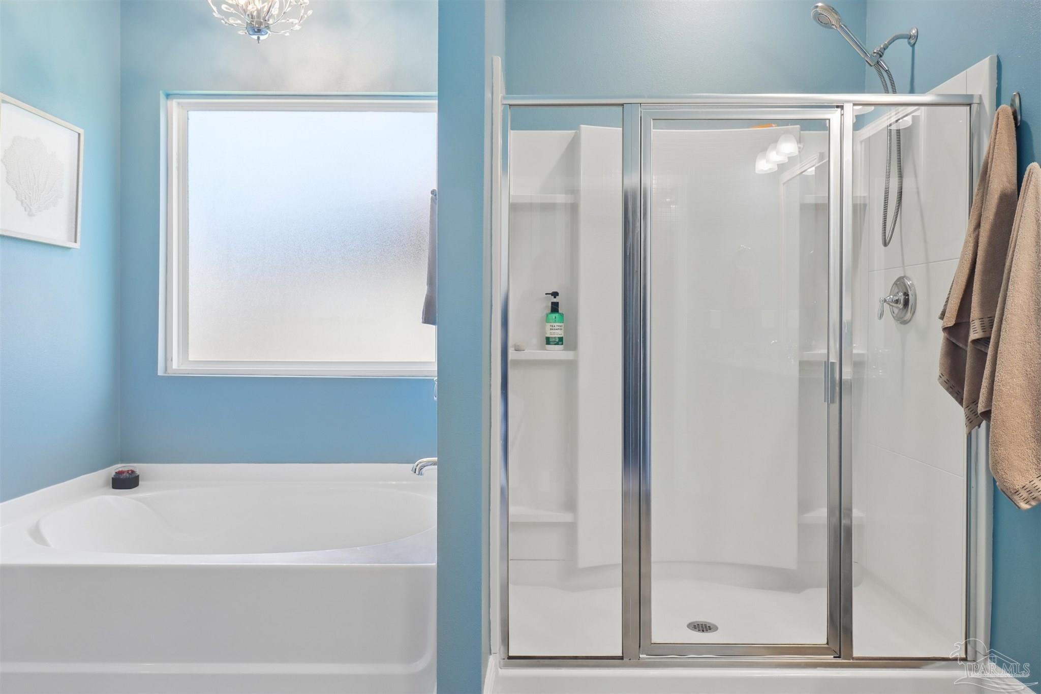 335 Cayden Way Cantonment, FL 32533 - Photo 24 of 30 a bathroom with a bathtub and a shower