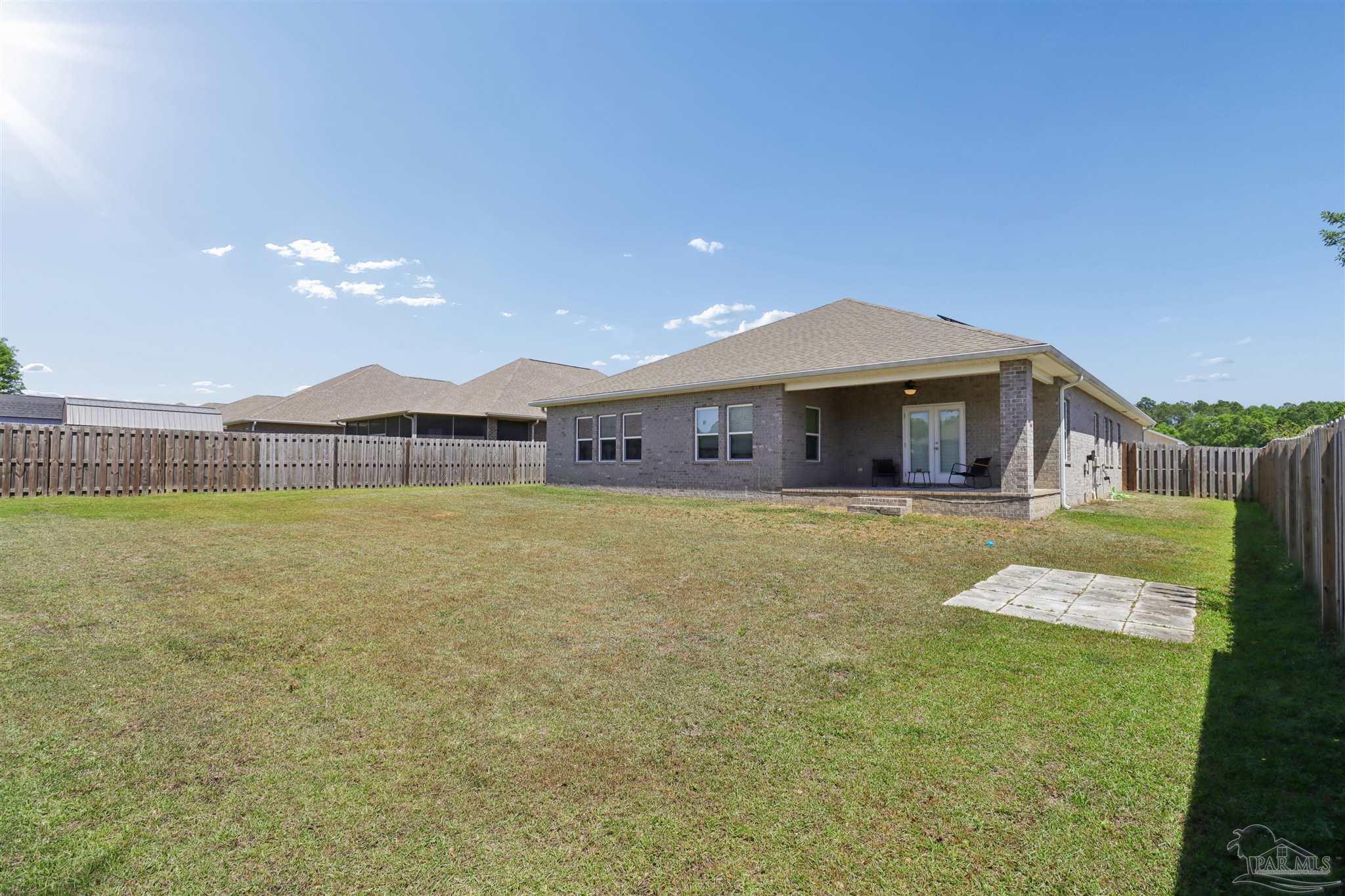 335 Cayden Way Cantonment, FL 32533 - Photo 26 of 30 a front view of a house with a yard