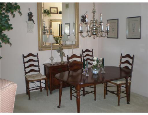 9727 Tavernier Drive Boca Raton, FL 33496 - Photo 4 of 16 a view of a dining room with furniture and chandelier
