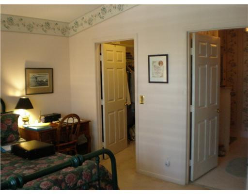 9727 Tavernier Drive Boca Raton, FL 33496 - Photo 7 of 16 a room with furniture and a lamp